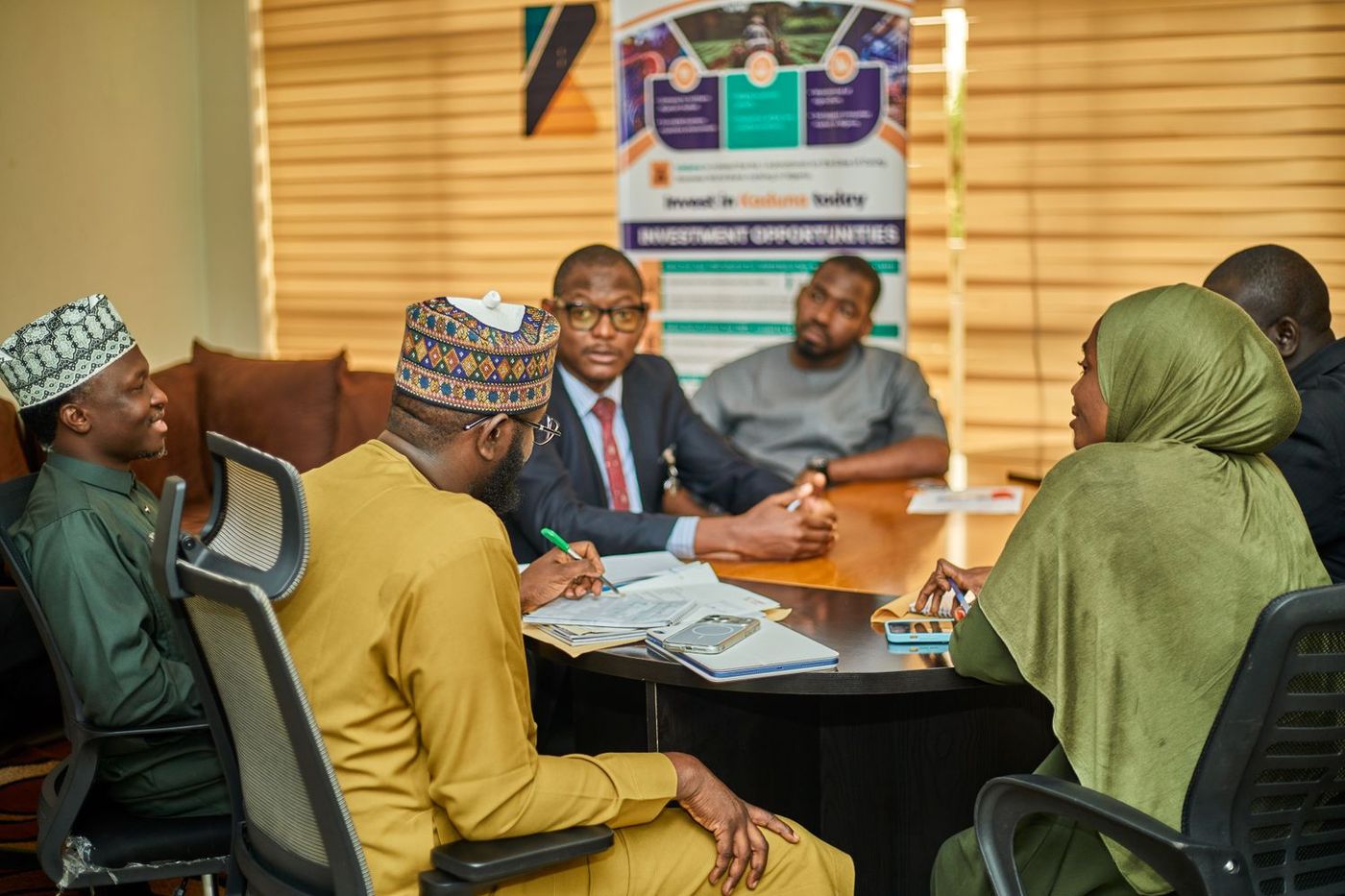 Investors around a table at an investment meeting in Kaduna, Nigeria
